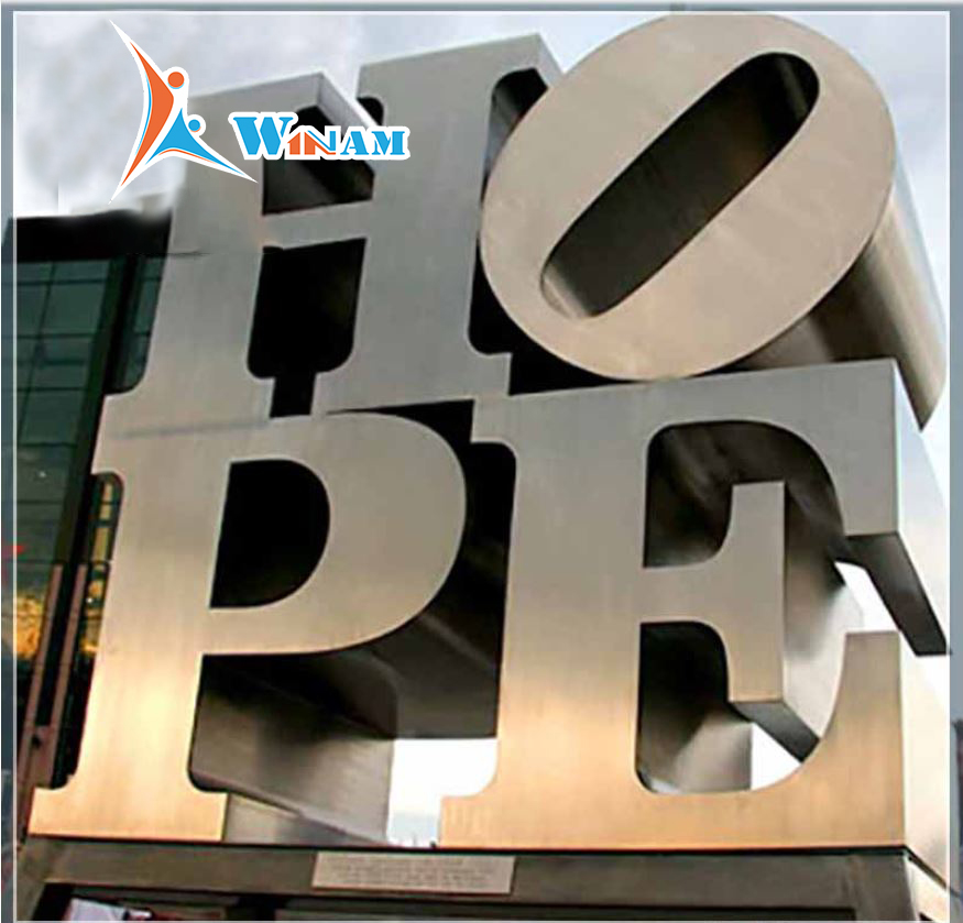 Large modern outdoor stainless steel letter sculpture