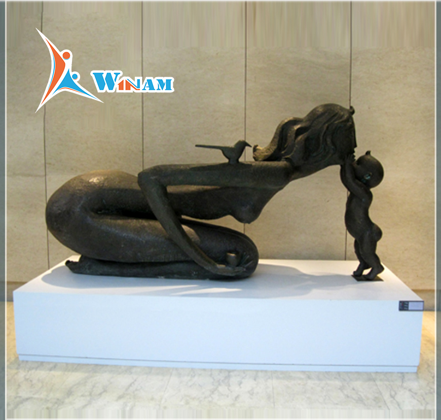 Warm life size bronze mother and son sculpture