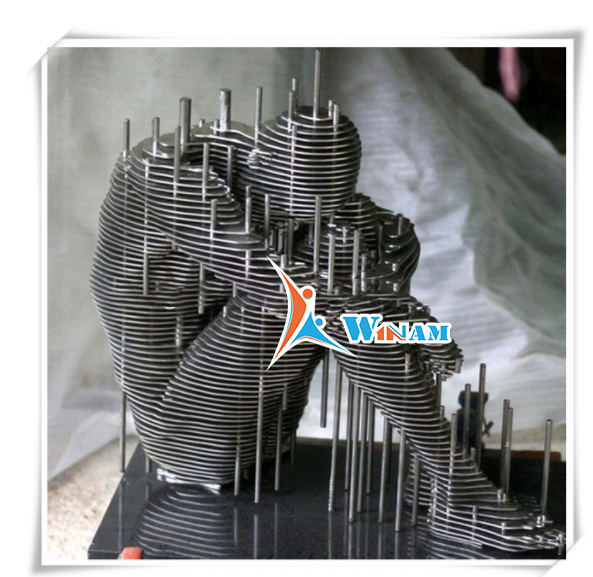 Modern sitting meditator stainless steel sculpture